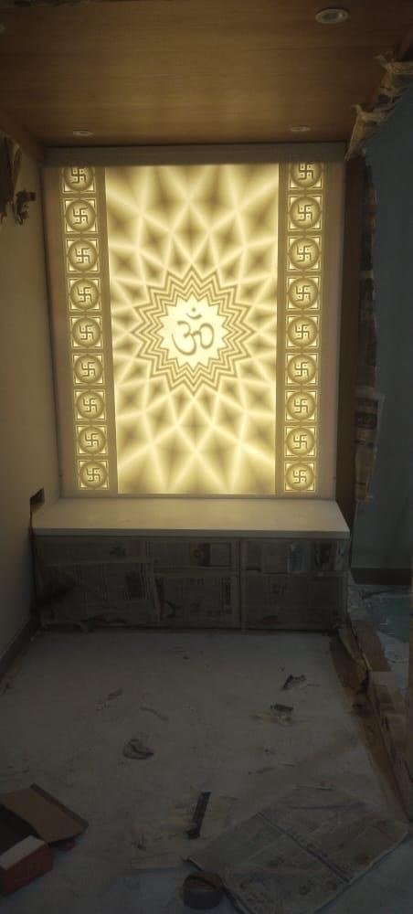 White decorative mandir with detailed pillars and storage