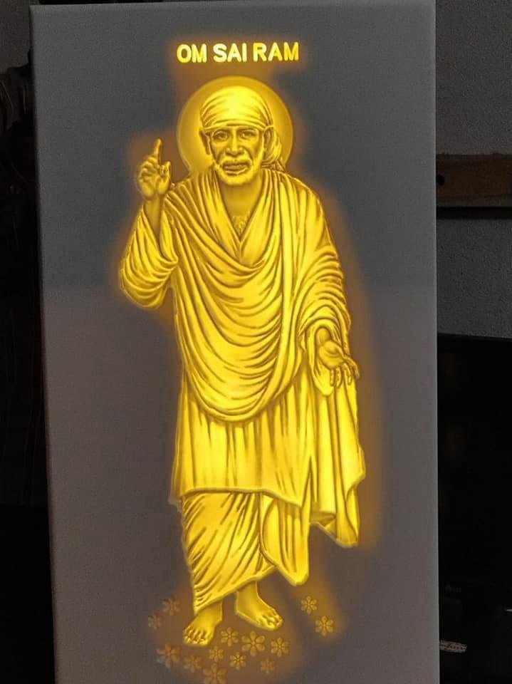 Illuminated peacock feather and Om devotional design